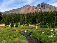 Stream and wild flowers in front of Broken Top