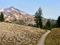 A slightly smoky view of the Sisters approaching Green Lakes